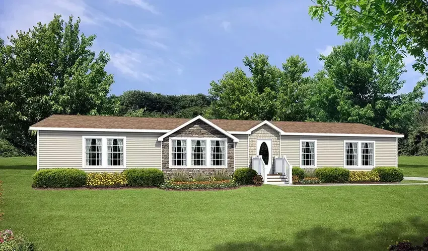 A modular duplex in Houston featuring a gray exterior, black shutters, and two front doors under a gabled roof. Trees enhance the backdrop.