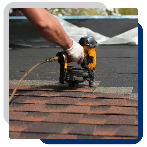 Roof repair team fixing damaged shingles on a home in Moline, IL 