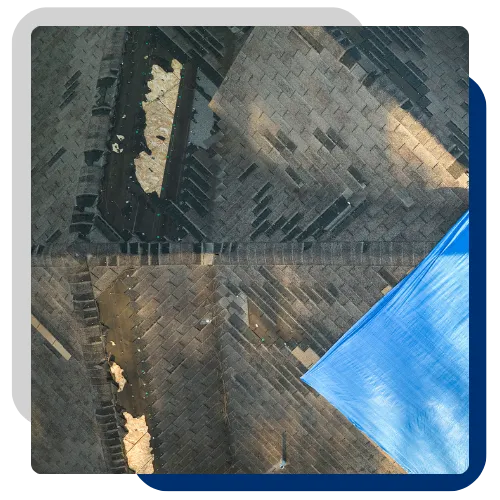 Emergency roof leak protection with tarp placement after storm damage in Moline, IL. 