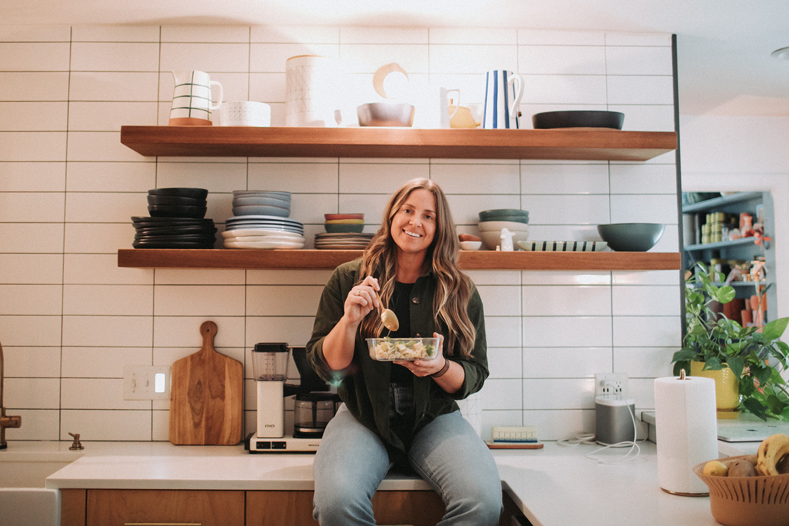 Cam Brown in her kitchen with a prepped meal