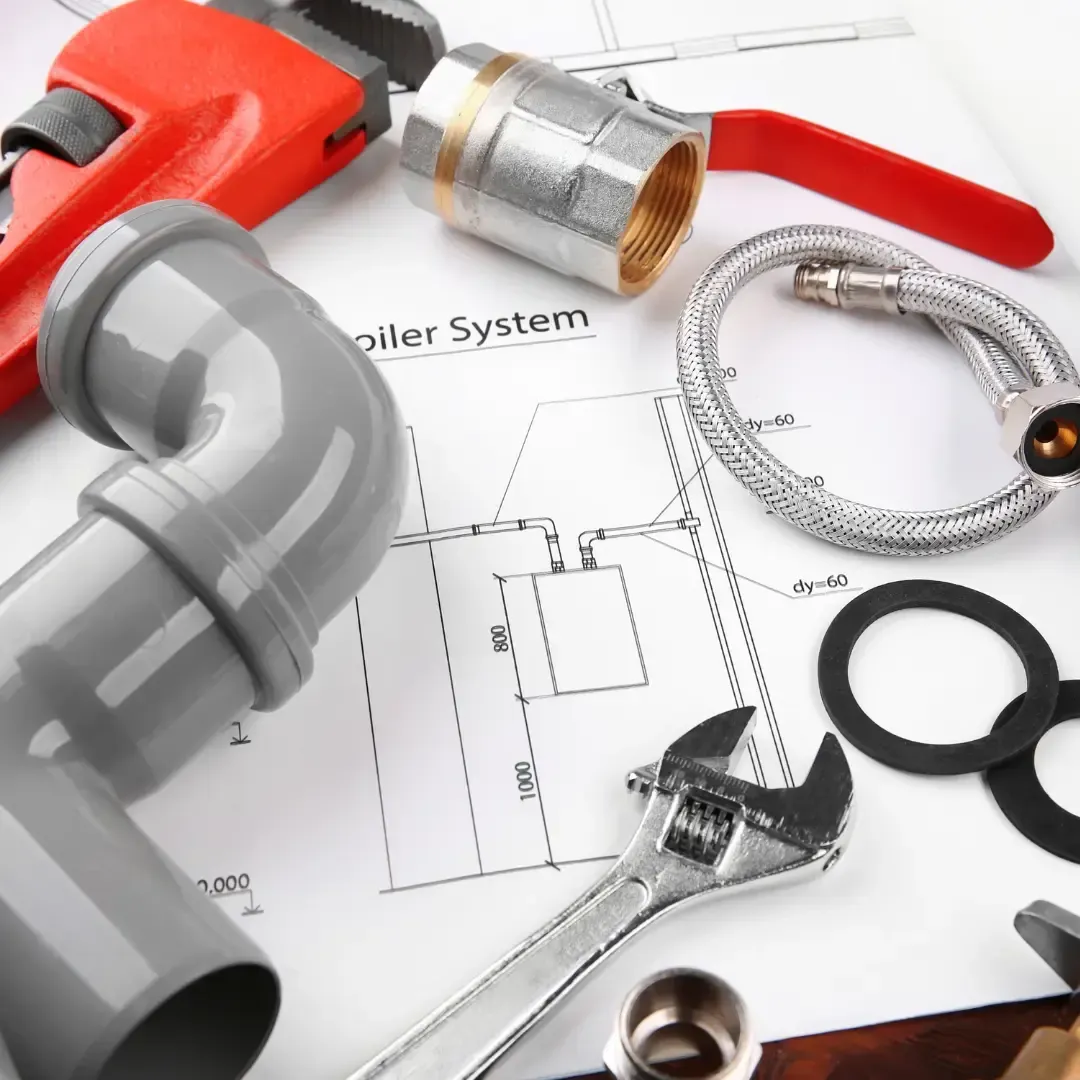 Plumbing inspection tools and fittings used for home water pressure testing and plumbing system checks by MMI Home Manager