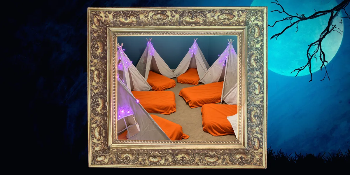 Spooky Sleepover party rental: teepee tents with purple string lights over orange sleeping mats