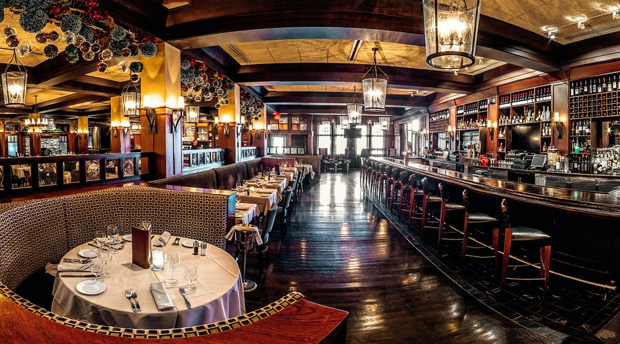 a long table with a bunch of glasses on it