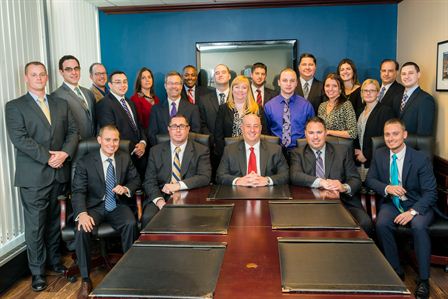 black and silver camera on brown wooden stand