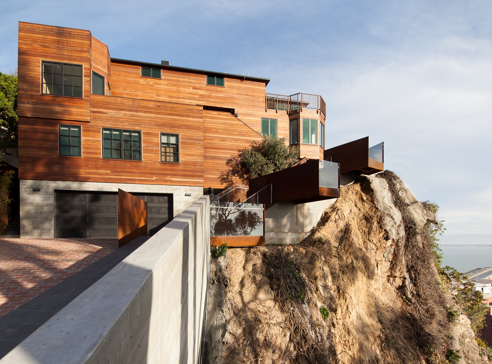 house on a cliff luxury modern wood siding, over looking san francisco