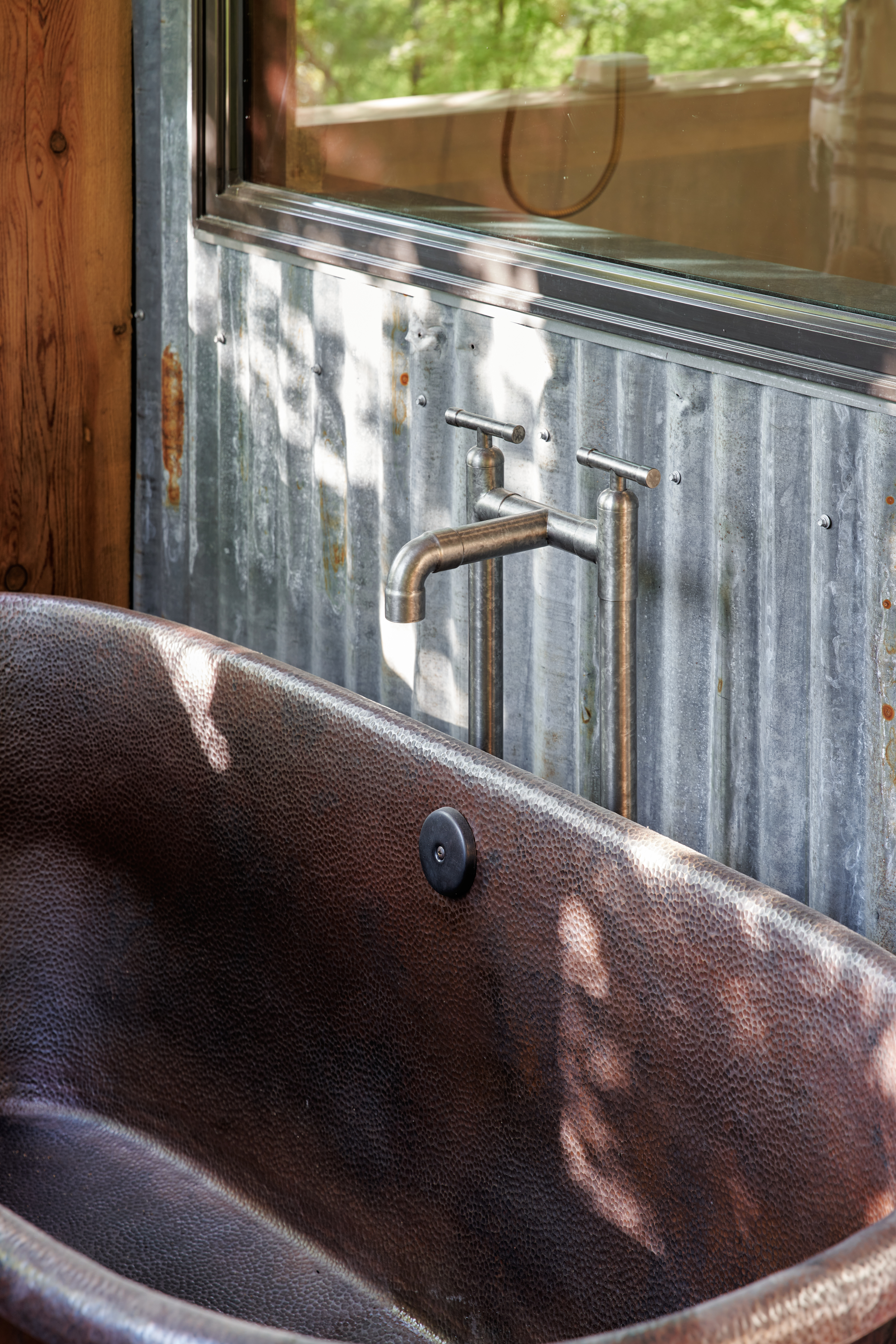 rustic copper tub and corrogated siding, rustic farm bathtub outdoor