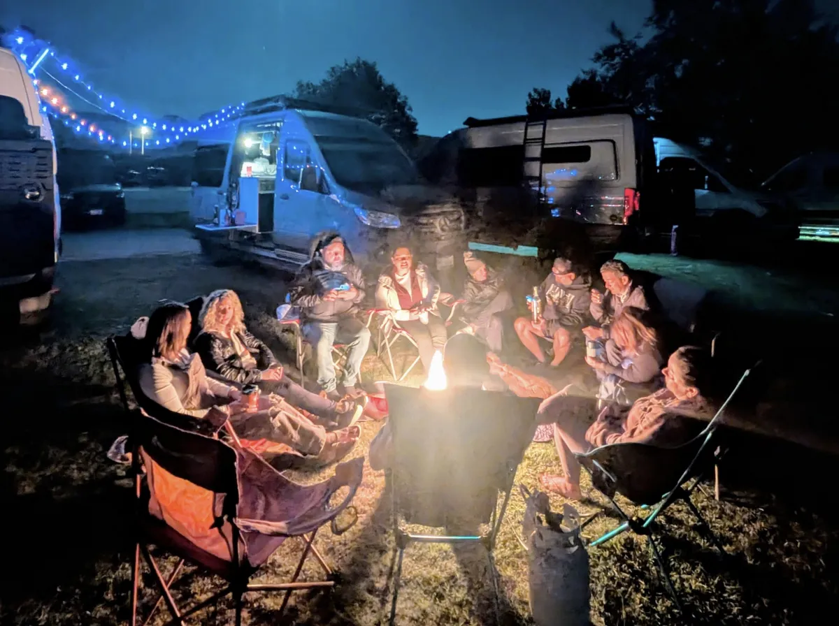 green grass field with pathway under blue sky