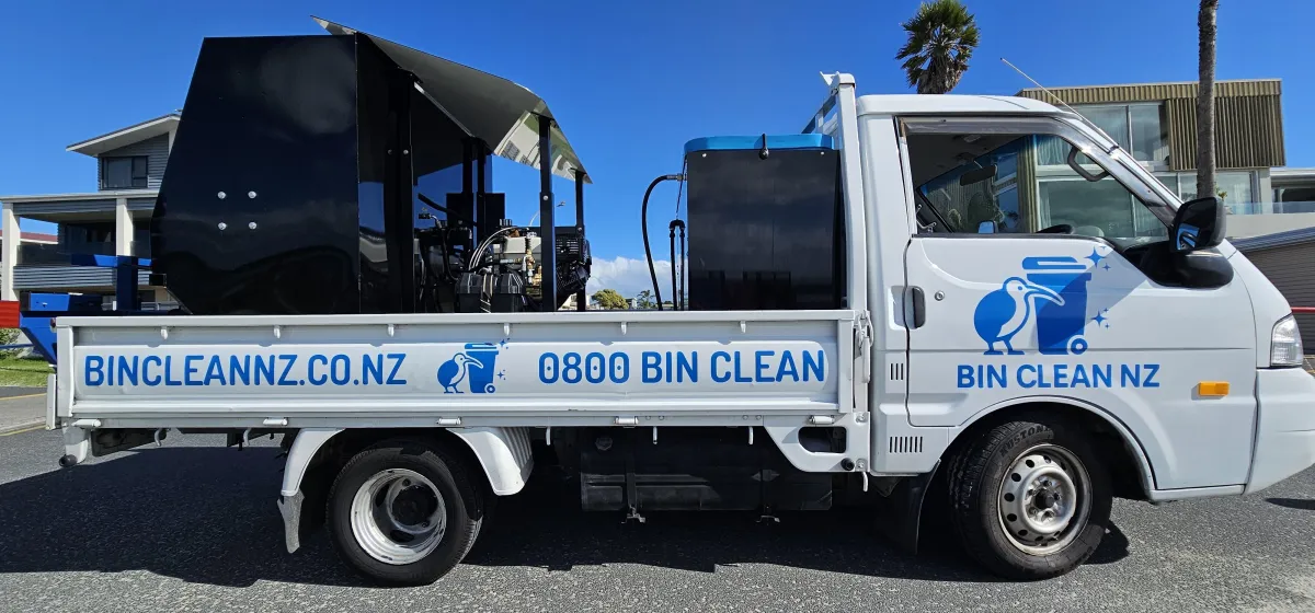 Bin Clean NZ truck showing BIN CLEAN NZ door logo and BINCLEANNZ.CO.NZ / 0800 BIN CLEAN signwriting on the tray