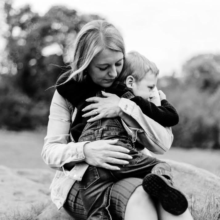 Jen cuddling little boy