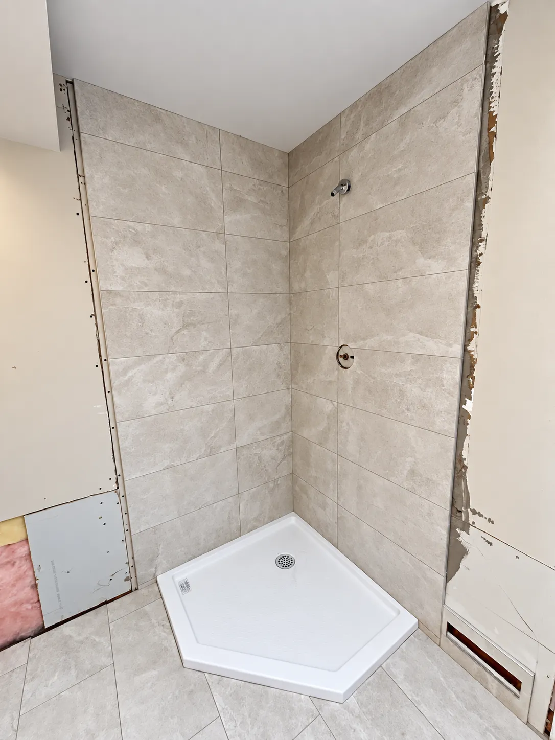 Finished shower wall tile installation in Calgary