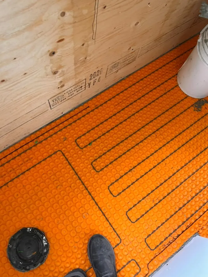Heated bathroom floor preparation for tile installation in Calgary