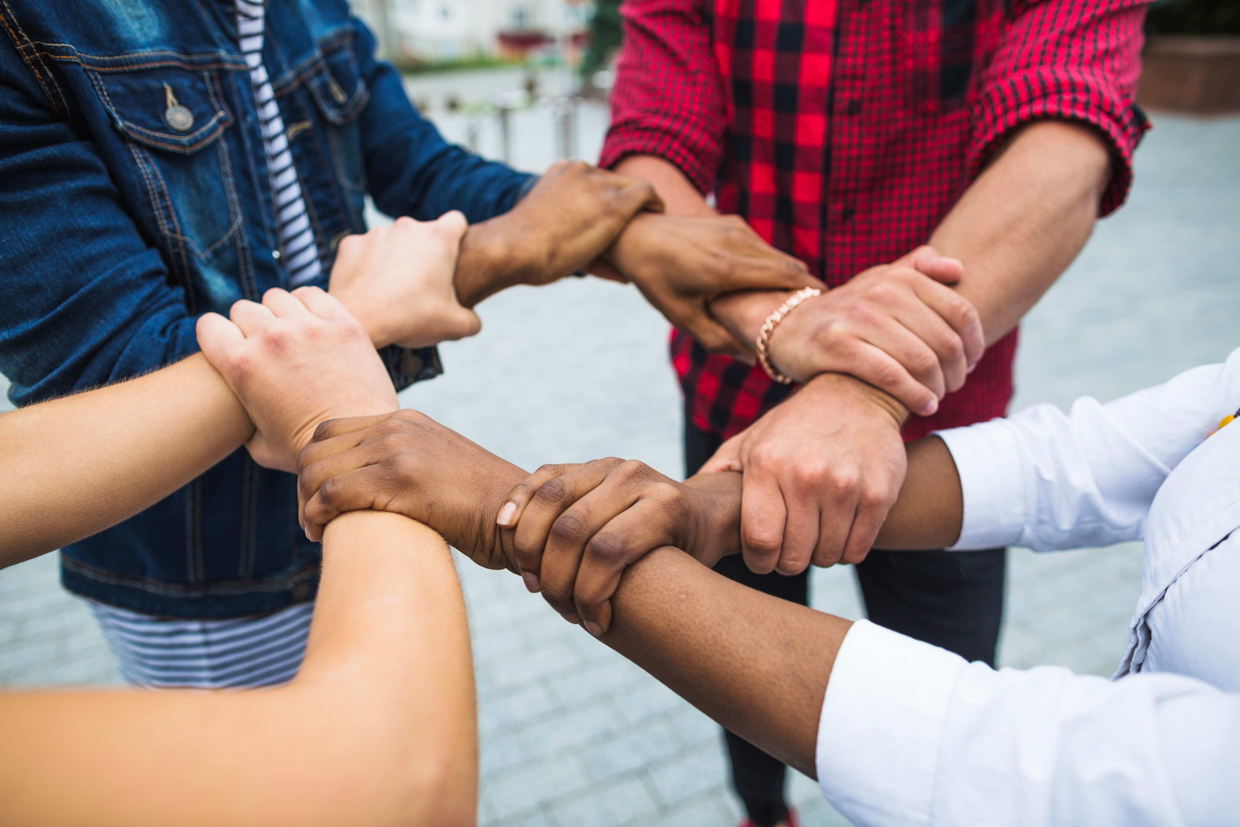 People interlocking hands