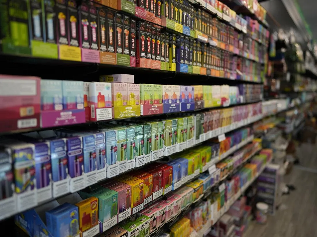 Variety of colorful vape pods in different shapes and brands at storm smoke shop in Seminole, FL.