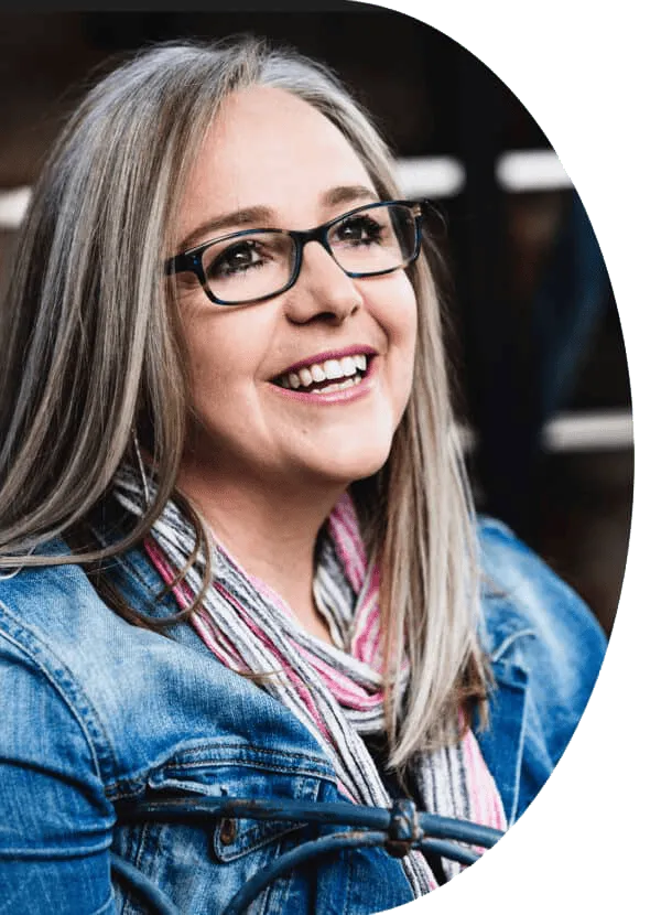 Portrait of the composer on a neutral studio background, warm natural lighting, three-quarter pose looking slightly off-camera. Photorealistic, high-resolution editorial crop intended for hero presence and press use.
