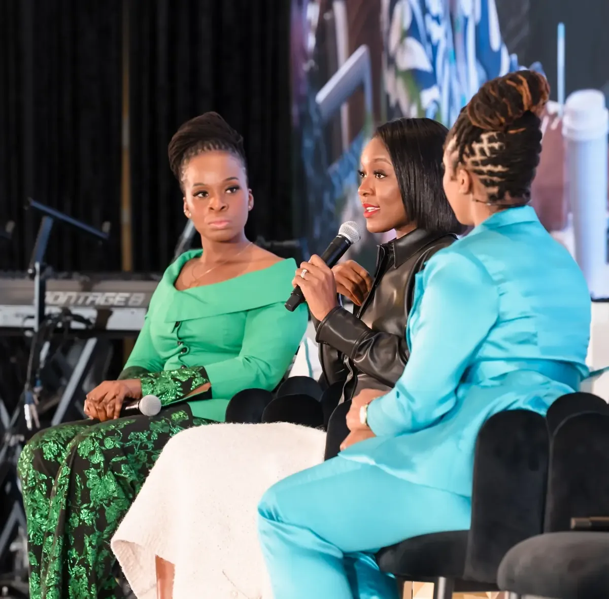Dr. Ogo leading a panel discussion with two healthcare founders