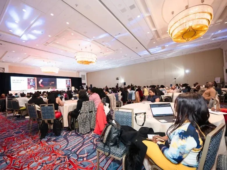 Wide view of a Career Haven funding event in a hotel ballroom