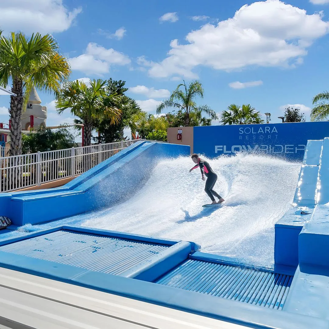 Image of person surfing at Solara Resort's Surfrider Surf Simulator