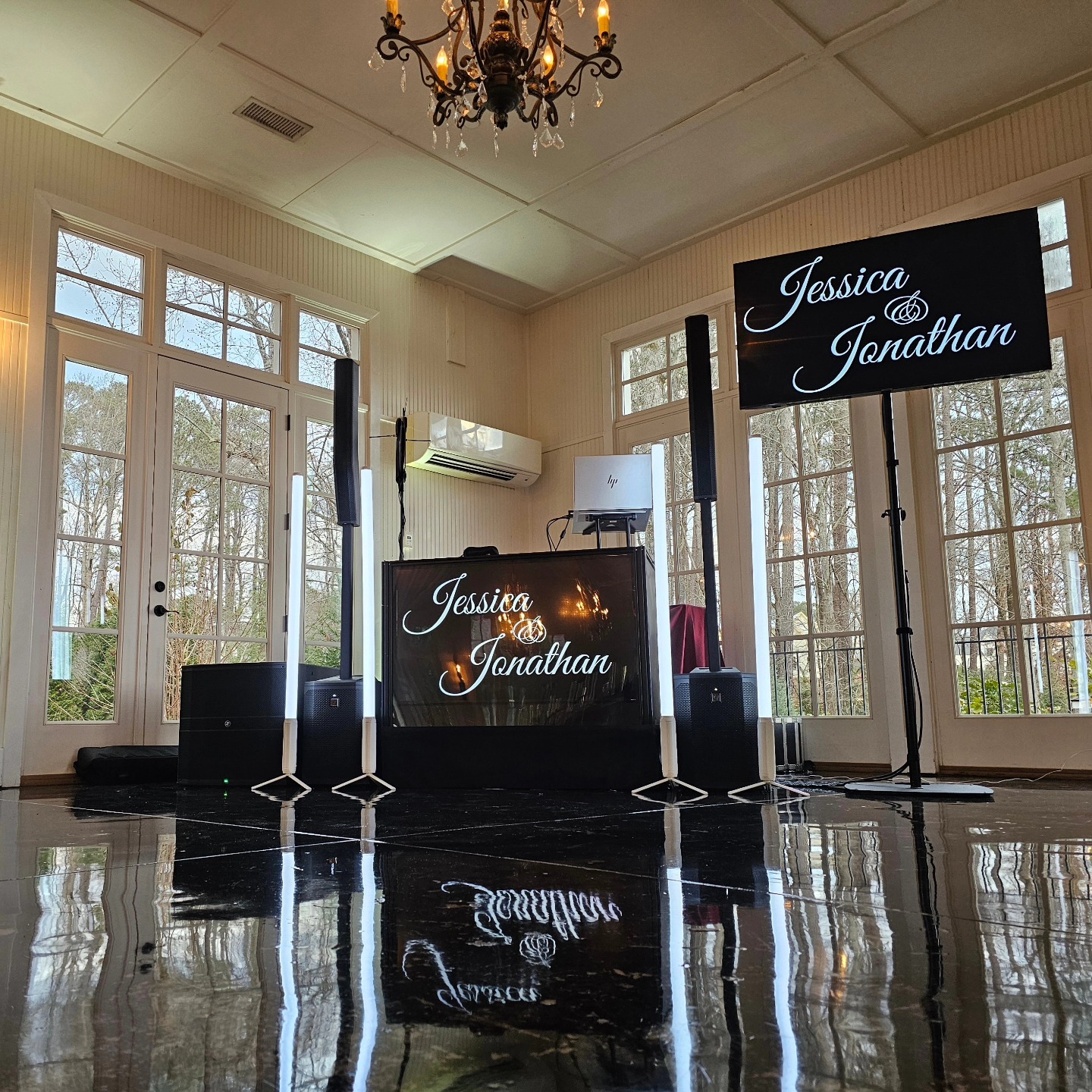 Bride and groom sharing a first dance in an elegant ballroom with warm lighting
