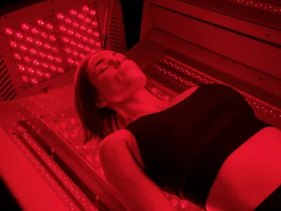 woman enjoying red light therapy