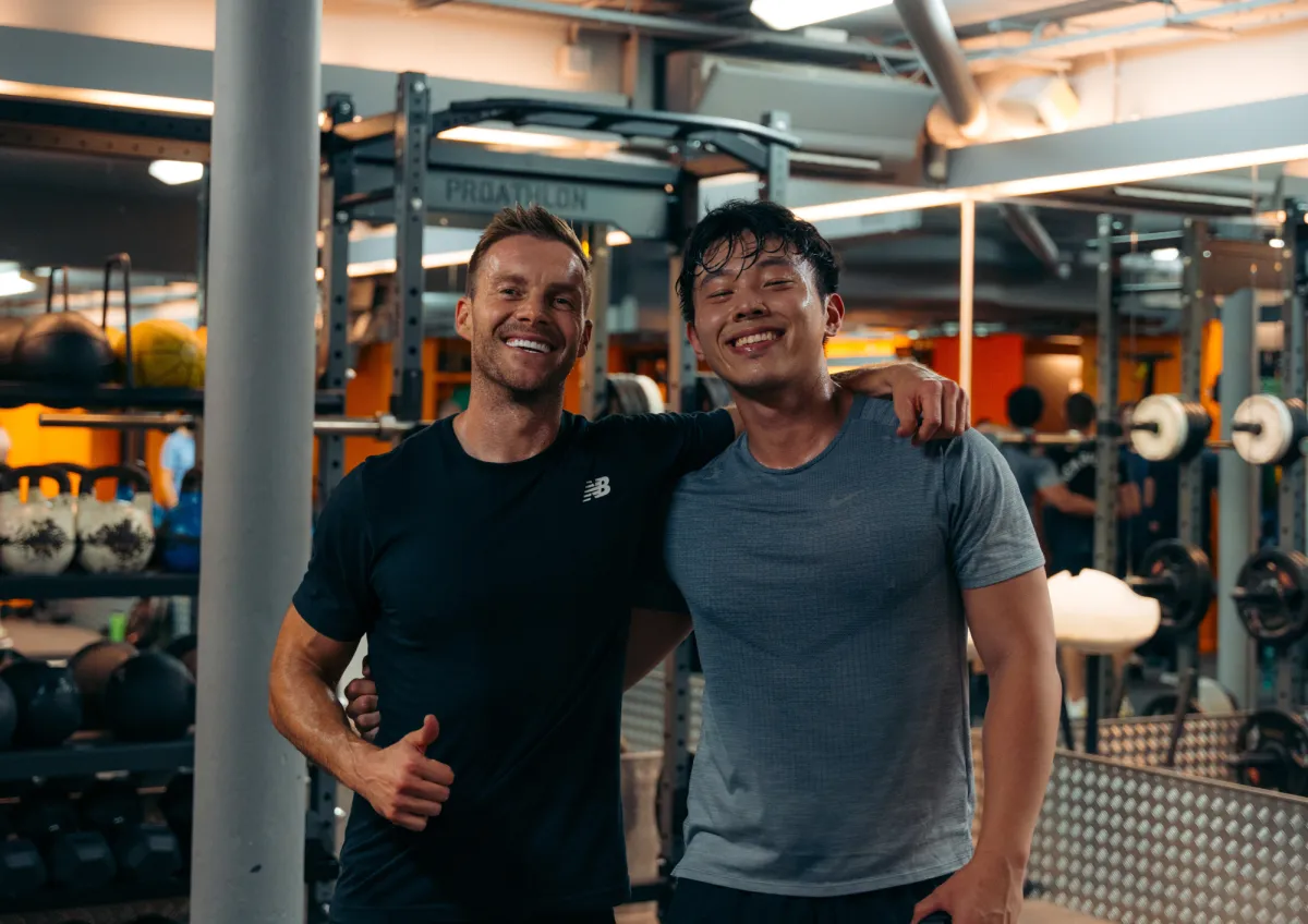 person facing down and holding two rods