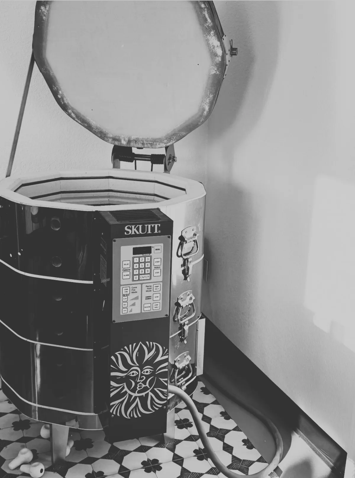 A hammer is stuck into a piece of wood