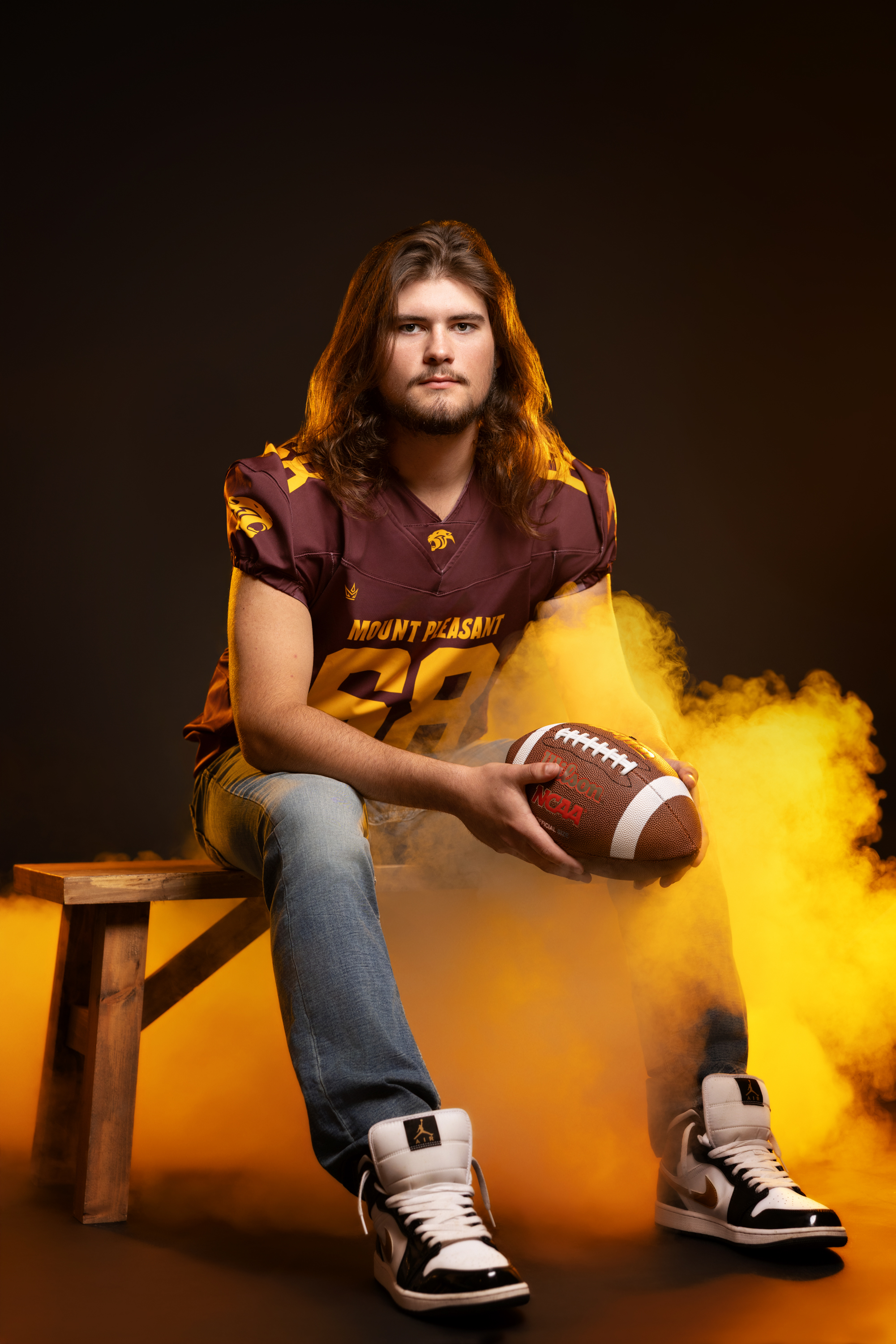 Senior portrait of athlete with sports gear