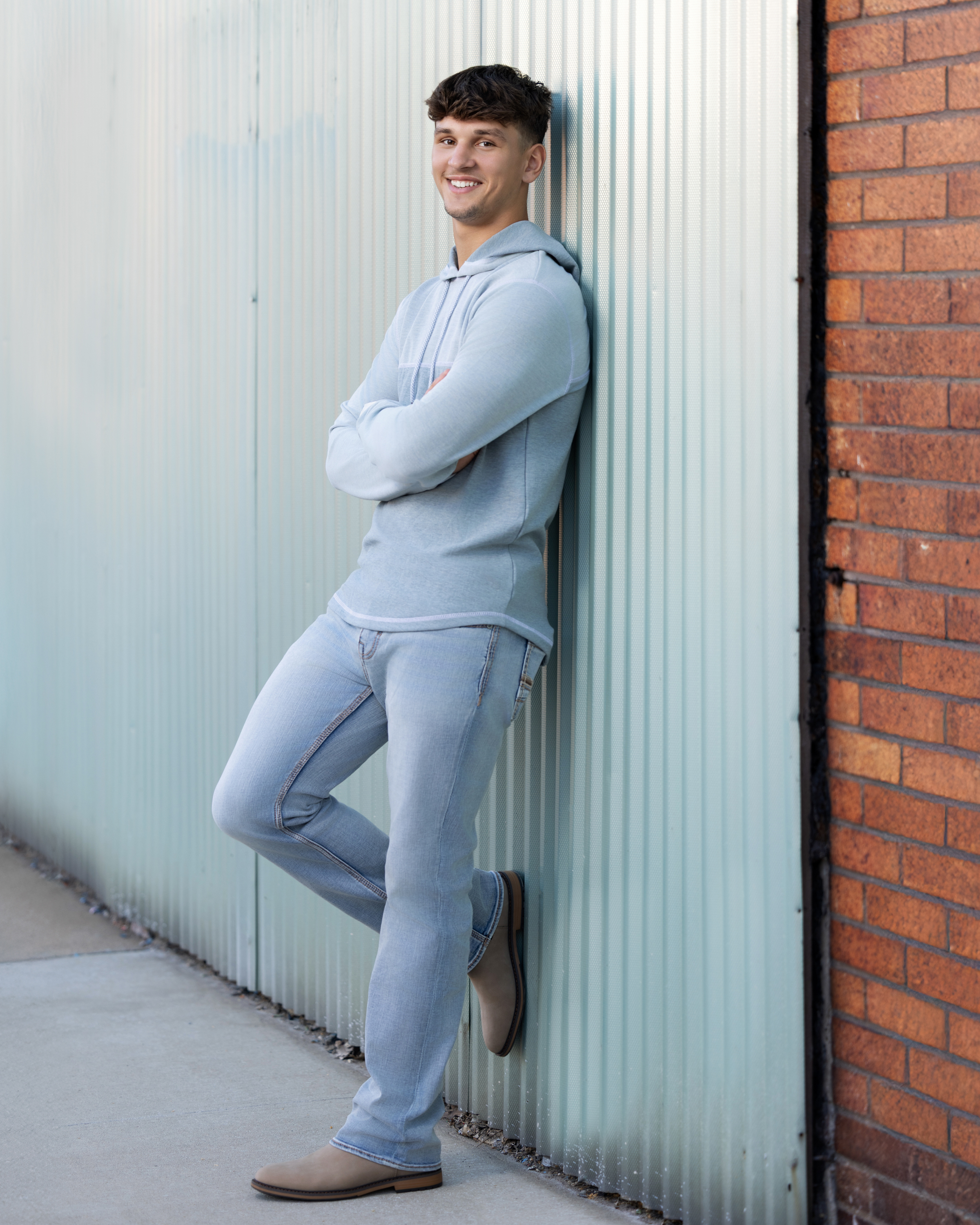 Senior girl laughing during golden hour outdoor portrait session