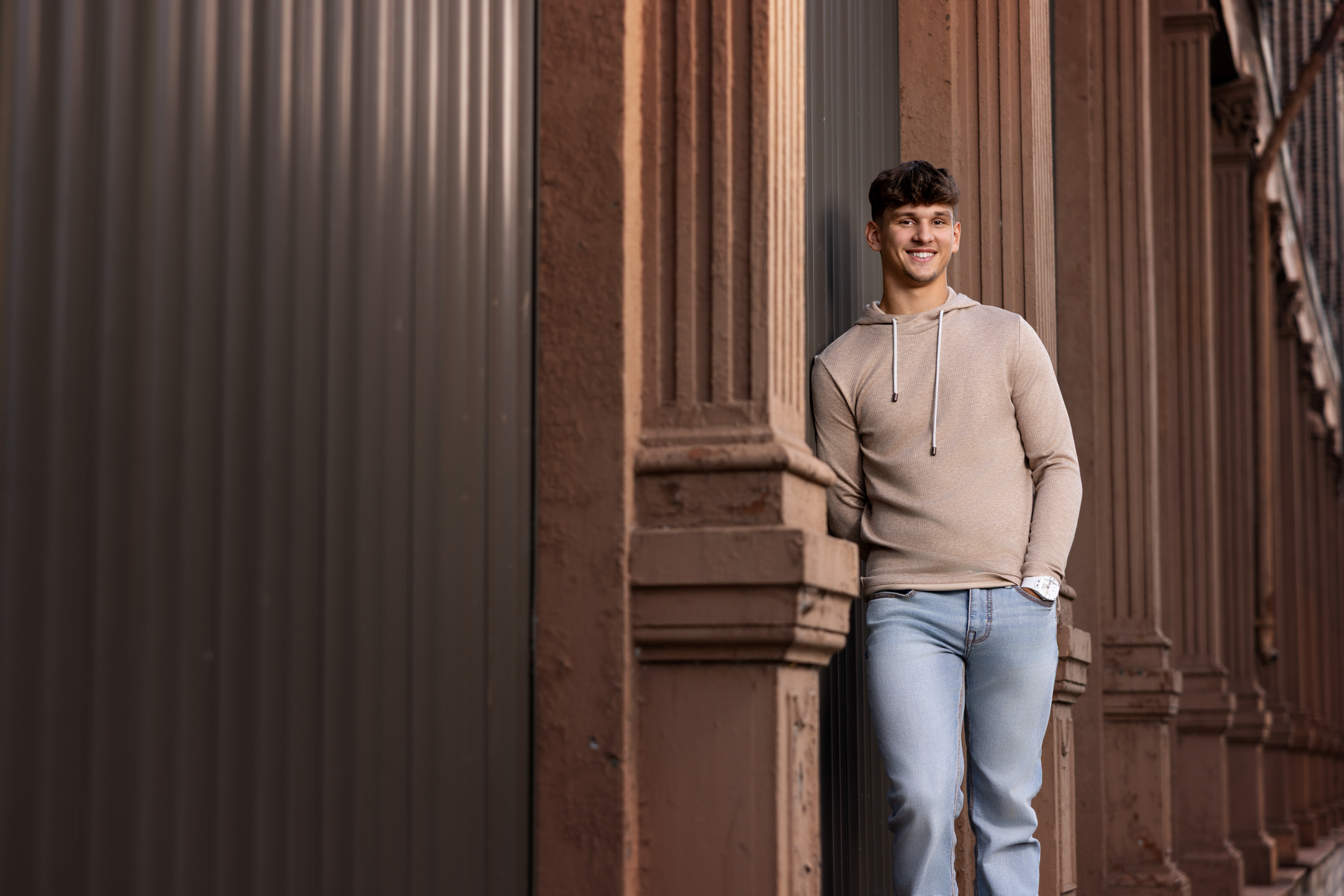 high school senior kyer in an urban setting for his senior portraits