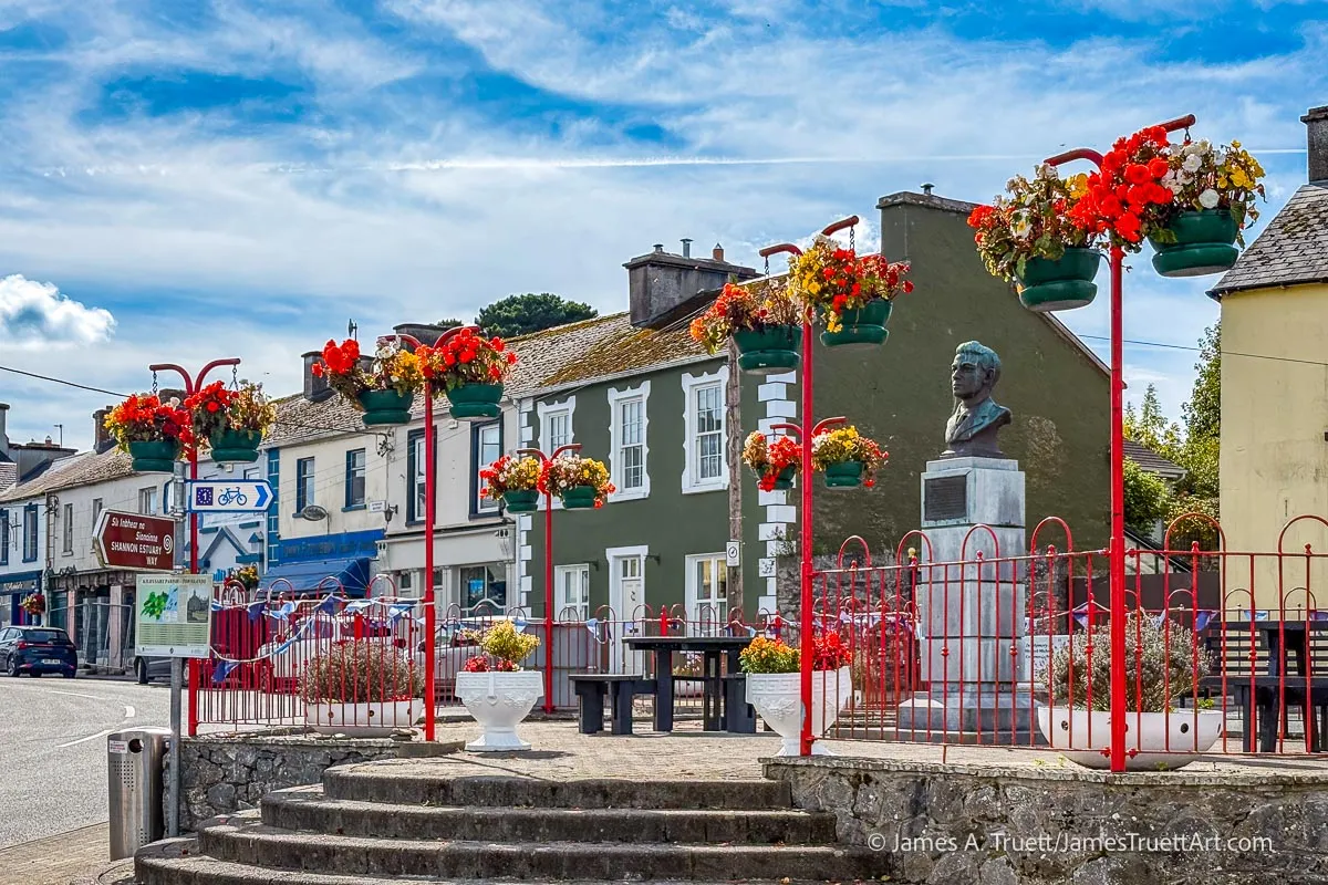 Kildysart Village Square brightly decorated with flowers in summer.