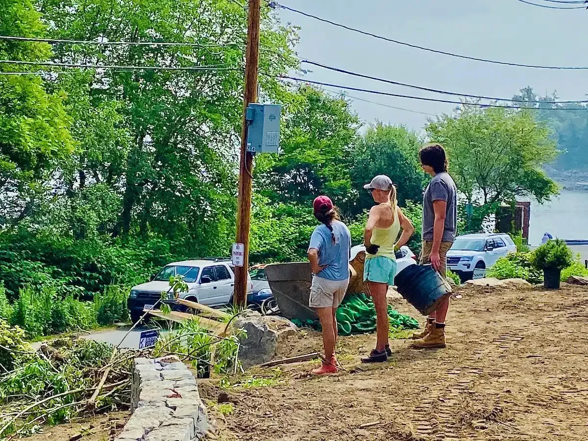 Garden maintenance crew preparing a waterfront residential landscape in Marblehead, MA