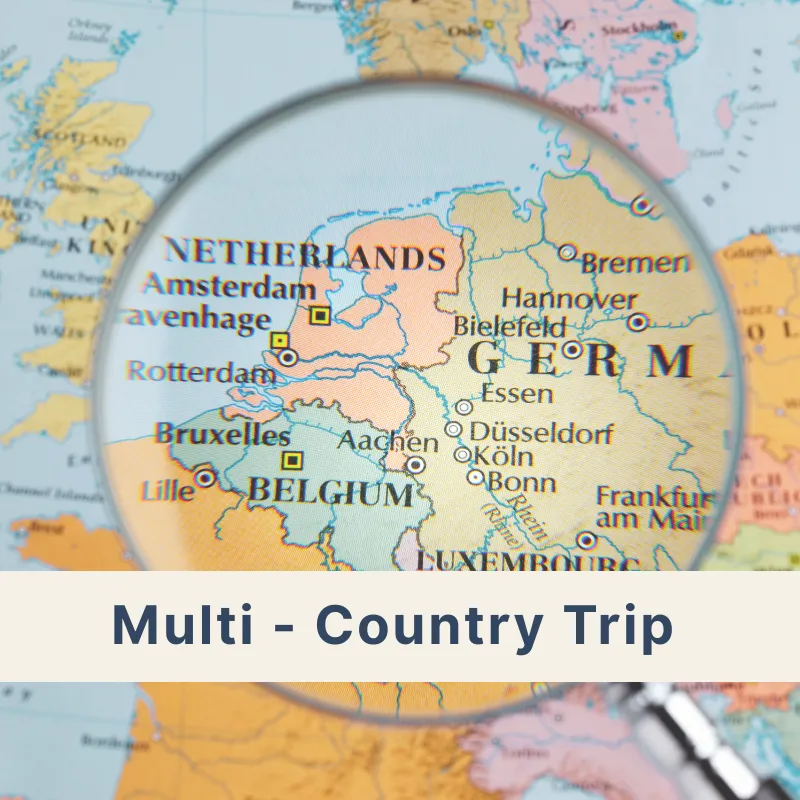Multiple European countries on a map under a magnifying glass, representing multi-country trips across Austria, Germany, Switzerland, and Europe