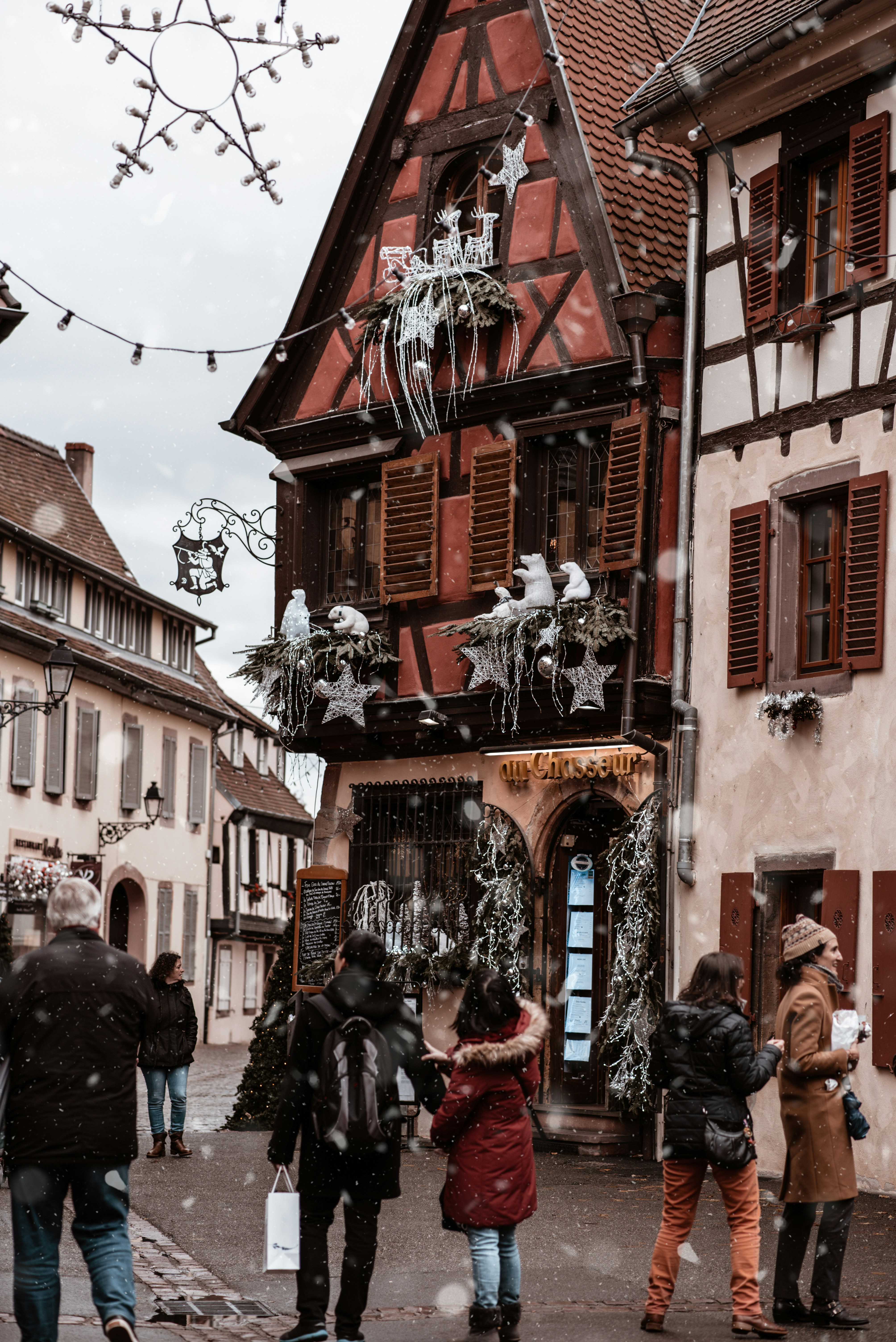 Alsace village street with half-timbered houses in France