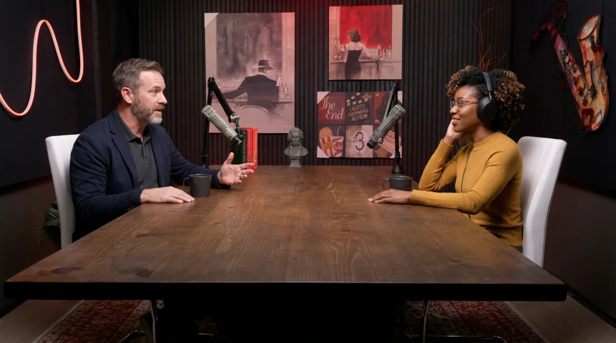 Podcast Room set with two guests seated at a table for an interview-style recording at Signature Sound Studios