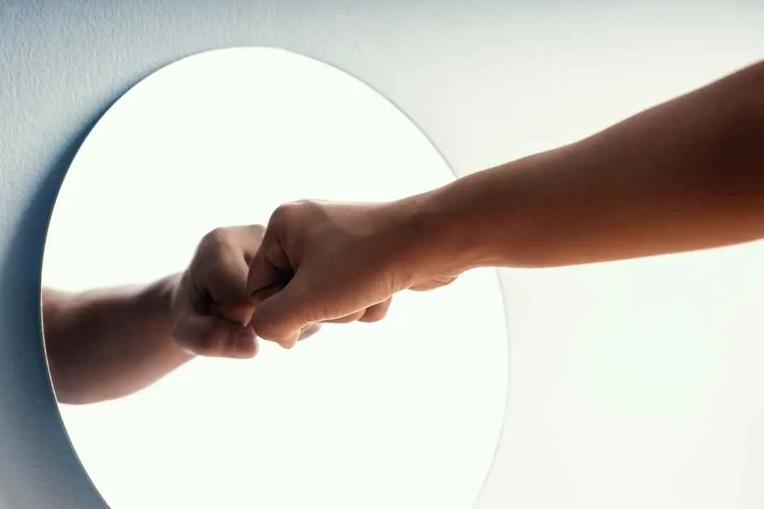A blue and green spiral on a black background