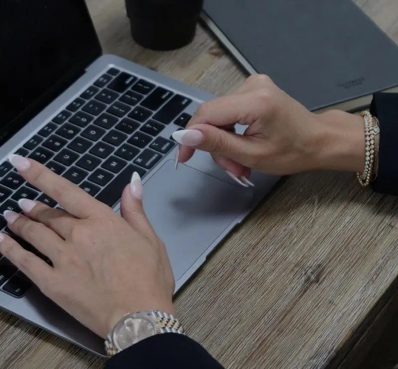 MacBook Pro near white open book