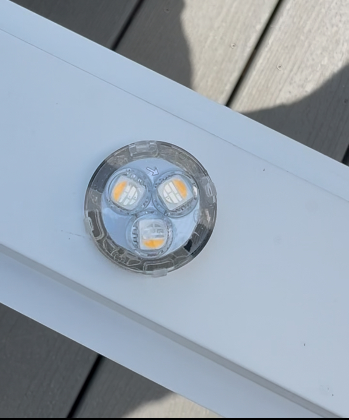 Hand holding a lightbulb.