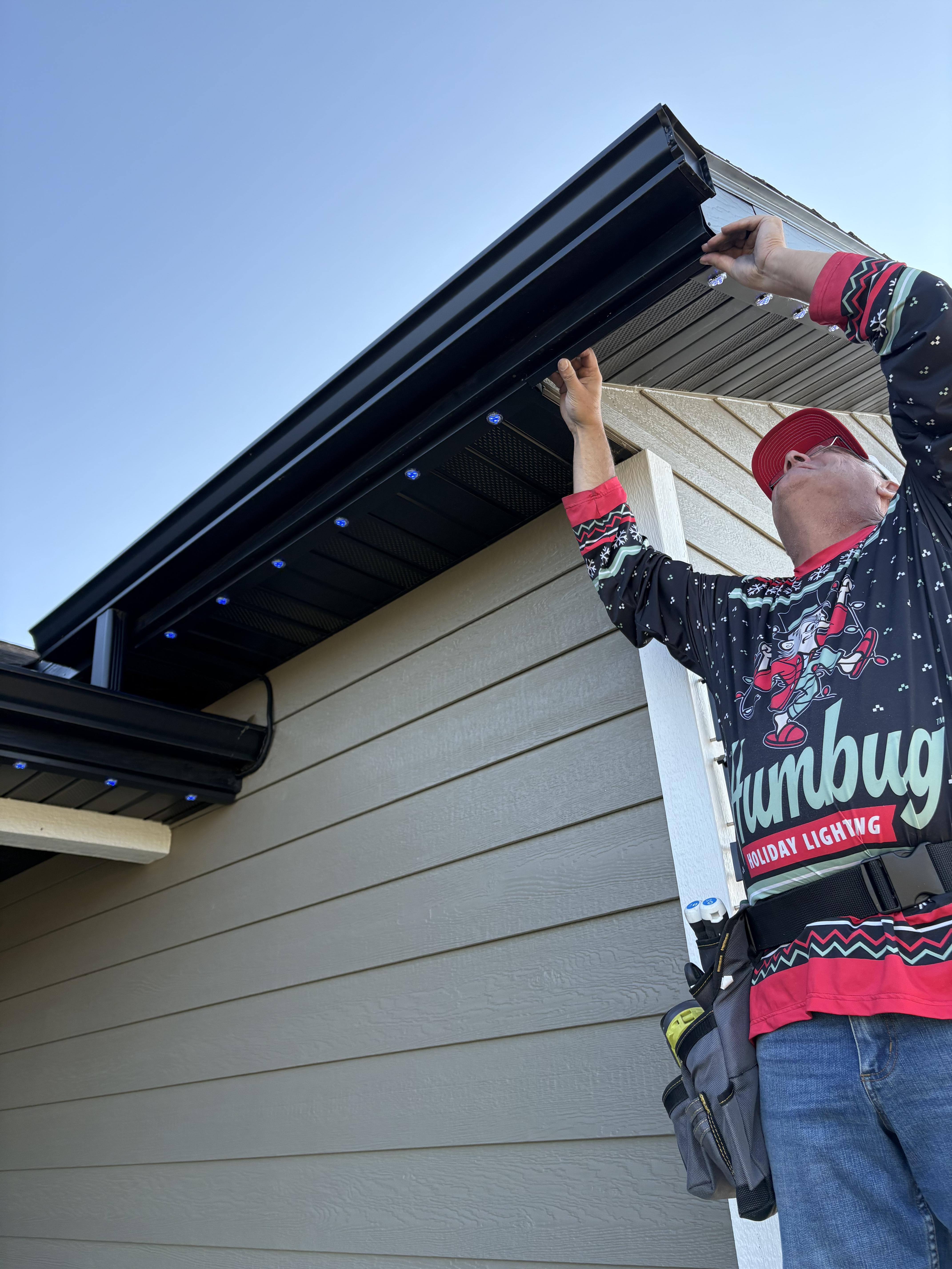 Hand holding a lightbulb.
