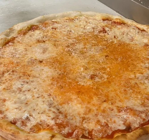 Plain kosher pizza pie from The Pizza Block, made with a secret sauce and a special blend of cheeses, freshly baked to perfection.