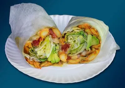 Crispy Chicken Wrap containing breaded tenders, lettuce, tomato, and ranch dressing.