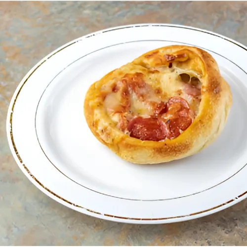 Pepperoni Wheels: Crispy, oven-baked pizza dough rolled with pepperoni, melted cheese, and savory seasonings