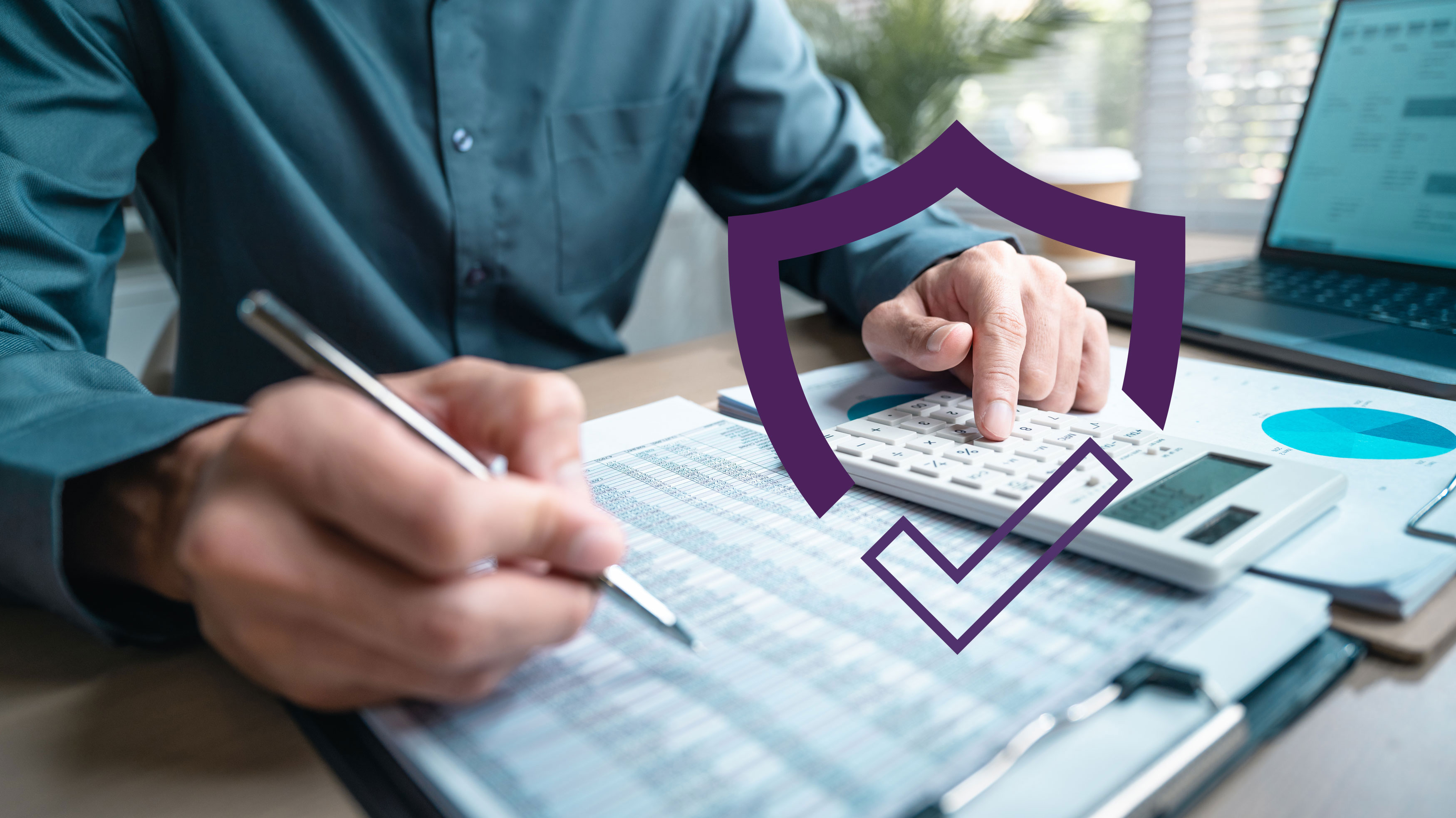 Person reviewing insurance documents at a desk with a calculator