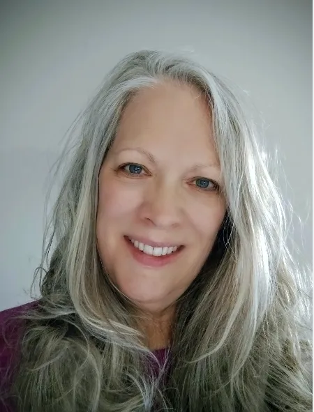 Portrait of the author in warm, desaturated tones