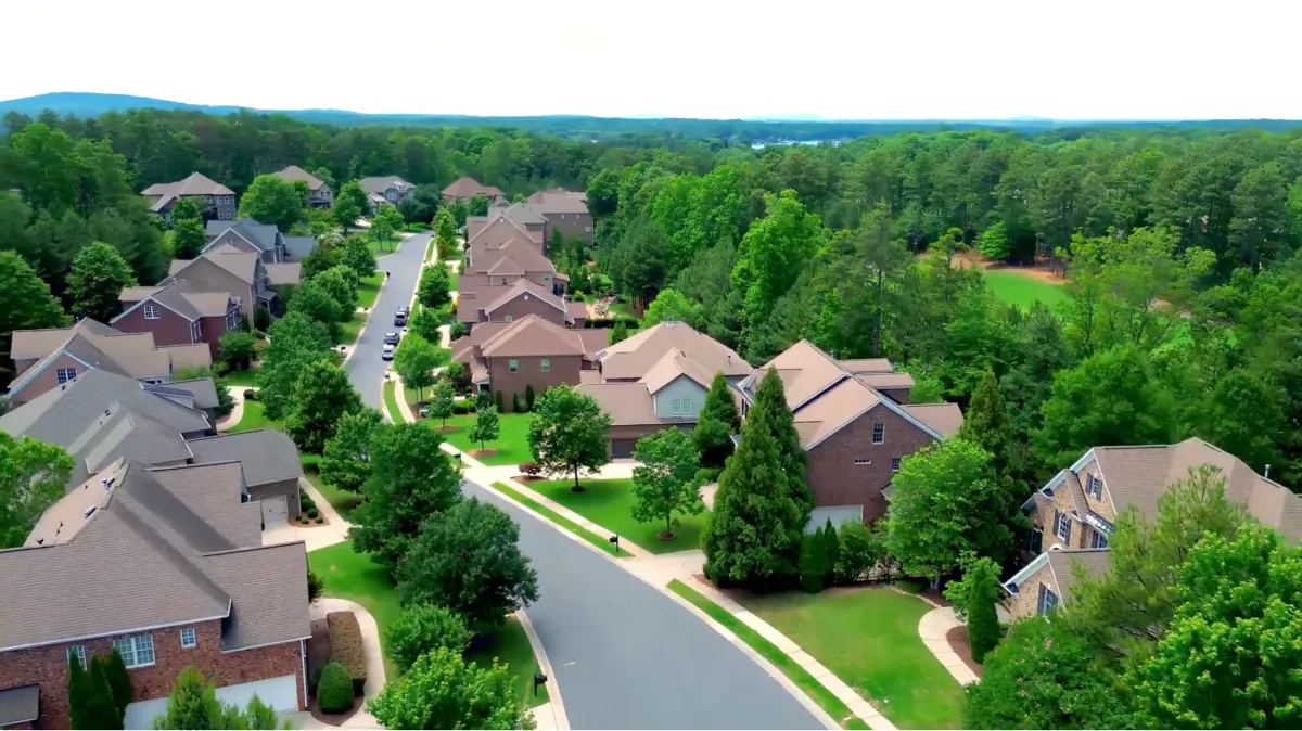 Aerial view of the Eagles Landing neighborhood featuring classic brick homes in The Palisades, Charlotte, North Carolina.