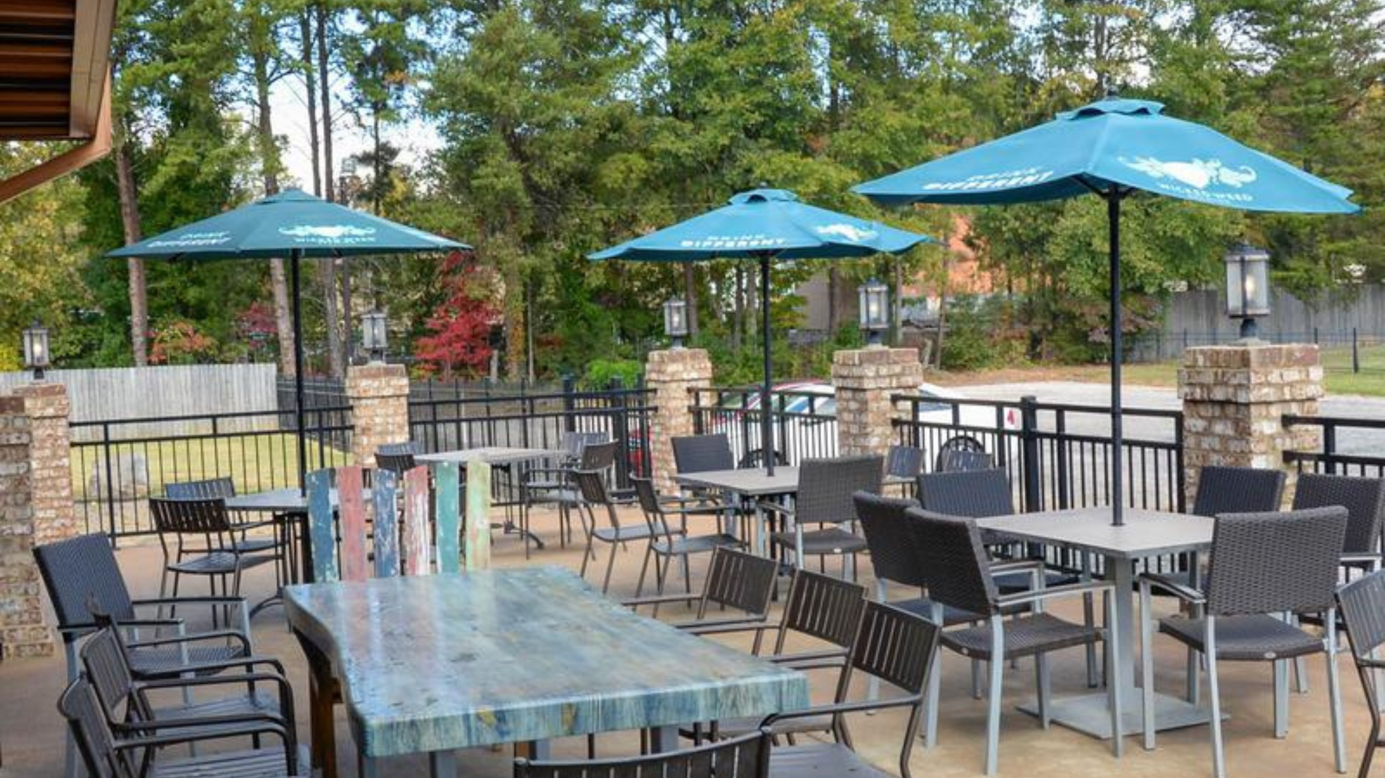 Outdoor patio seating at Copper Premium Pub in Lake Wylie, a casual neighborhood restaurant with burgers, salads, and drinks near The Palisades.