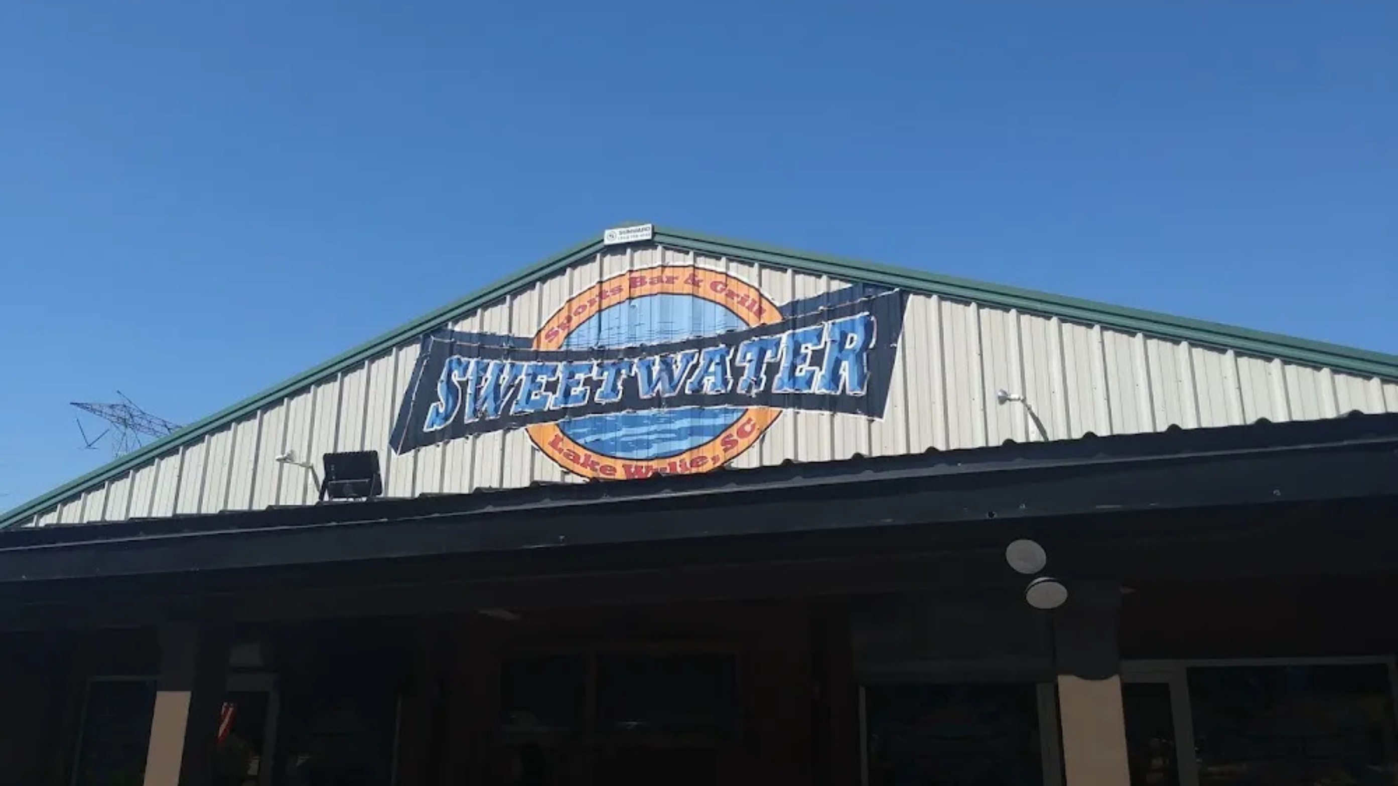 Exterior of Sweetwater Sports Bar & Grill in Lake Wylie, a waterfront restaurant and sports bar known for craft beer, casual dining, and outdoor seating near The Palisades.