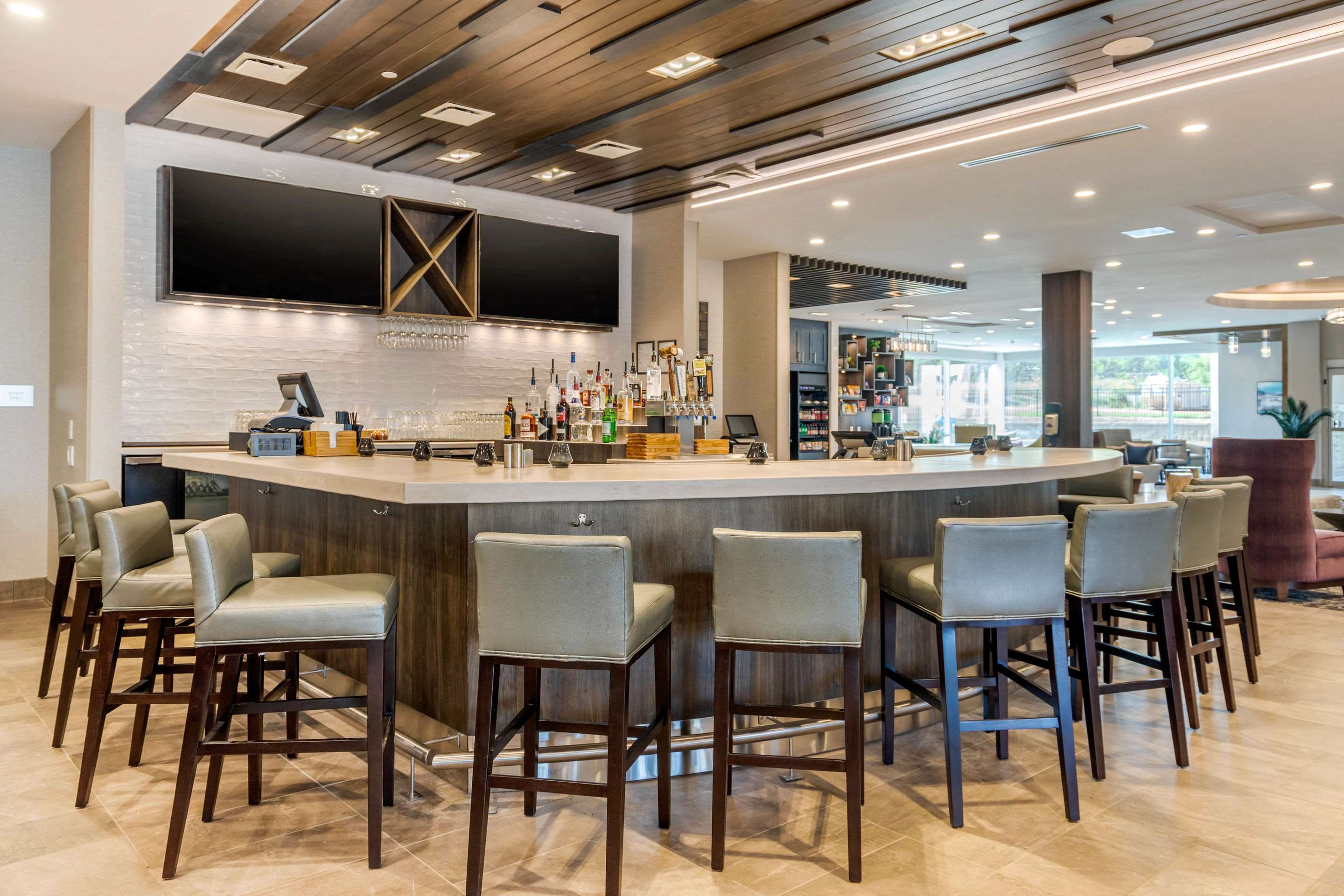 The Foxhole Restaurant & Bar in downtown Fort Mill featuring a modern bar, comfortable seating, craft cocktails, and a welcoming neighborhood atmosphere.