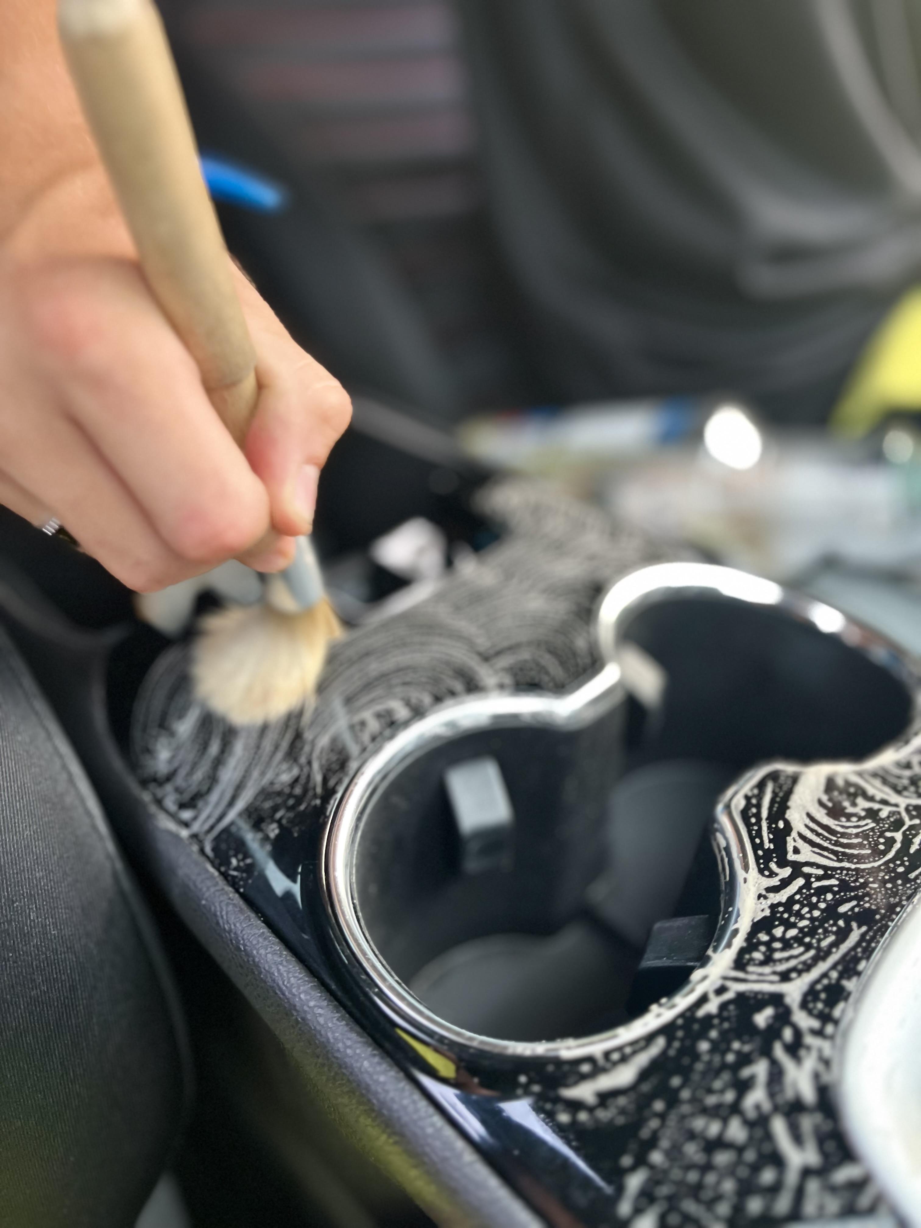 Mobile detailer cleaning car interior in Nashville Tennessee - Wash Dawgs Detail professional auto detailing service