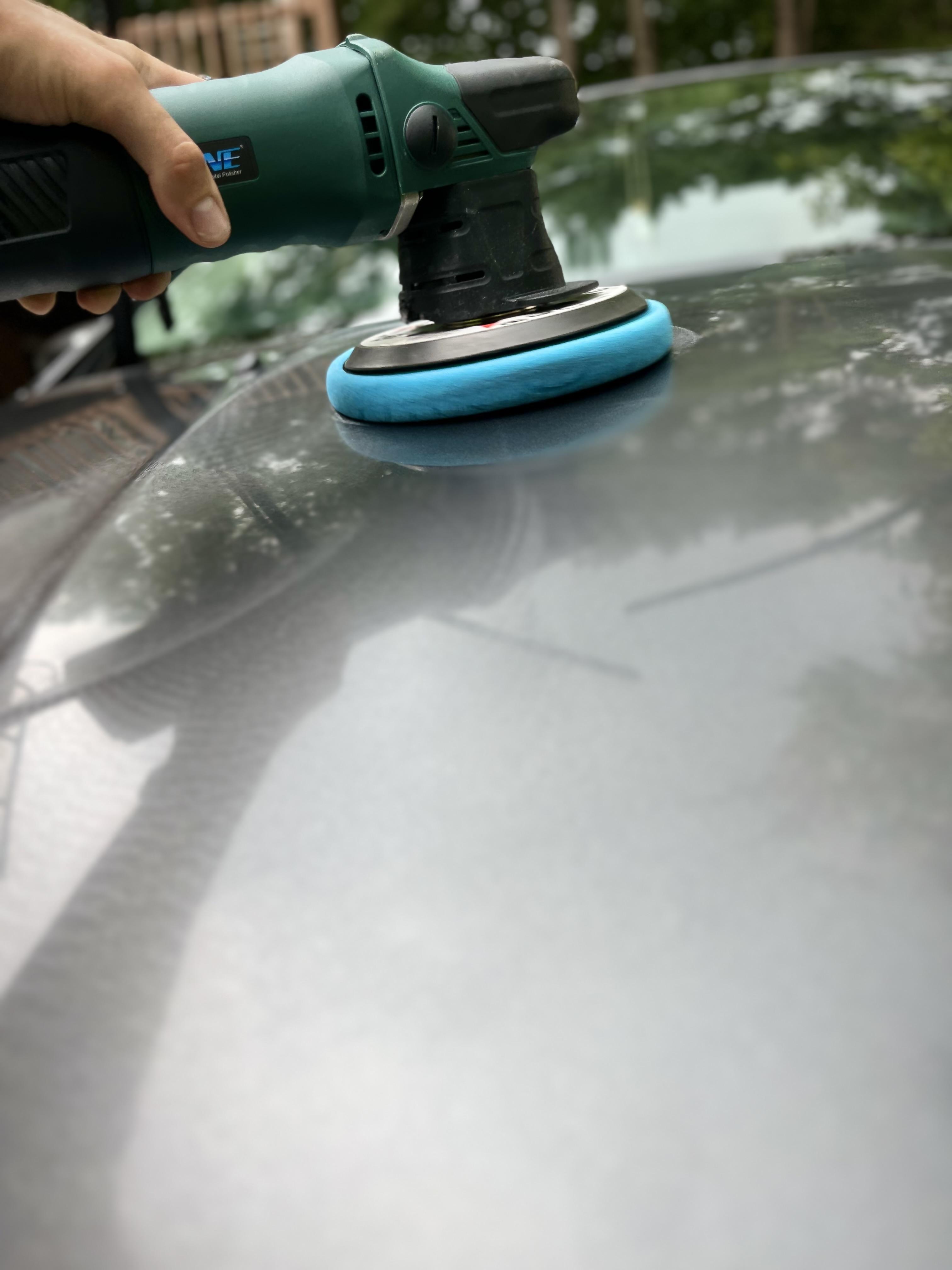 Wash Dawgs Detail polishing a car, mobile detail.