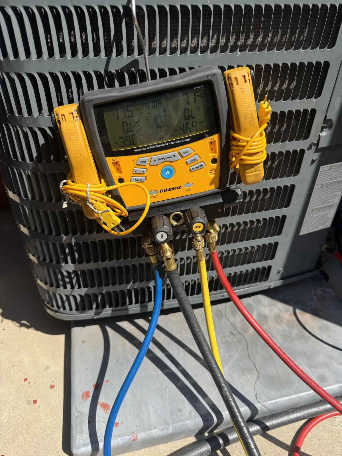 Season Solutions technician inspecting HVAC and electrical equipment