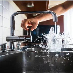 Water being splashed into a cup